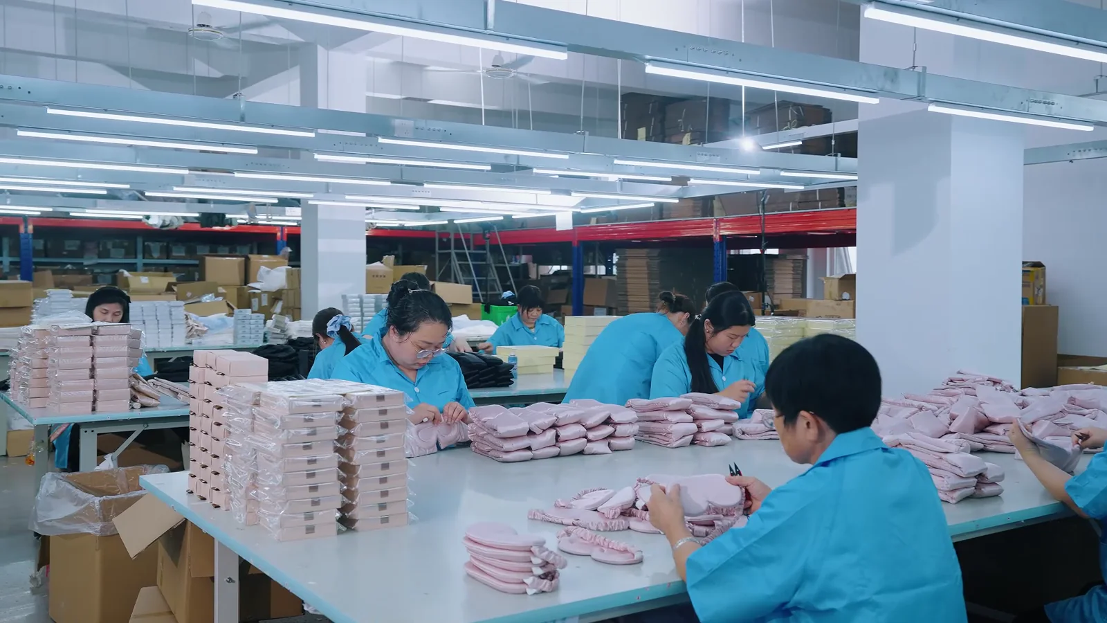Stitch Silk production team inspecting and organizing finished silk products