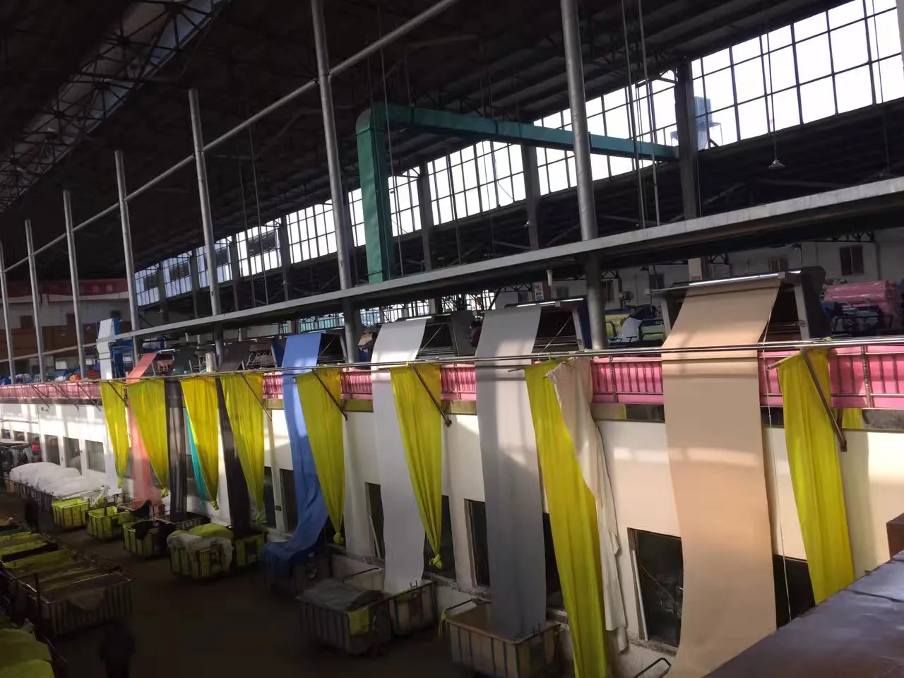 Fabric moving through a textile dyeing and finishing line