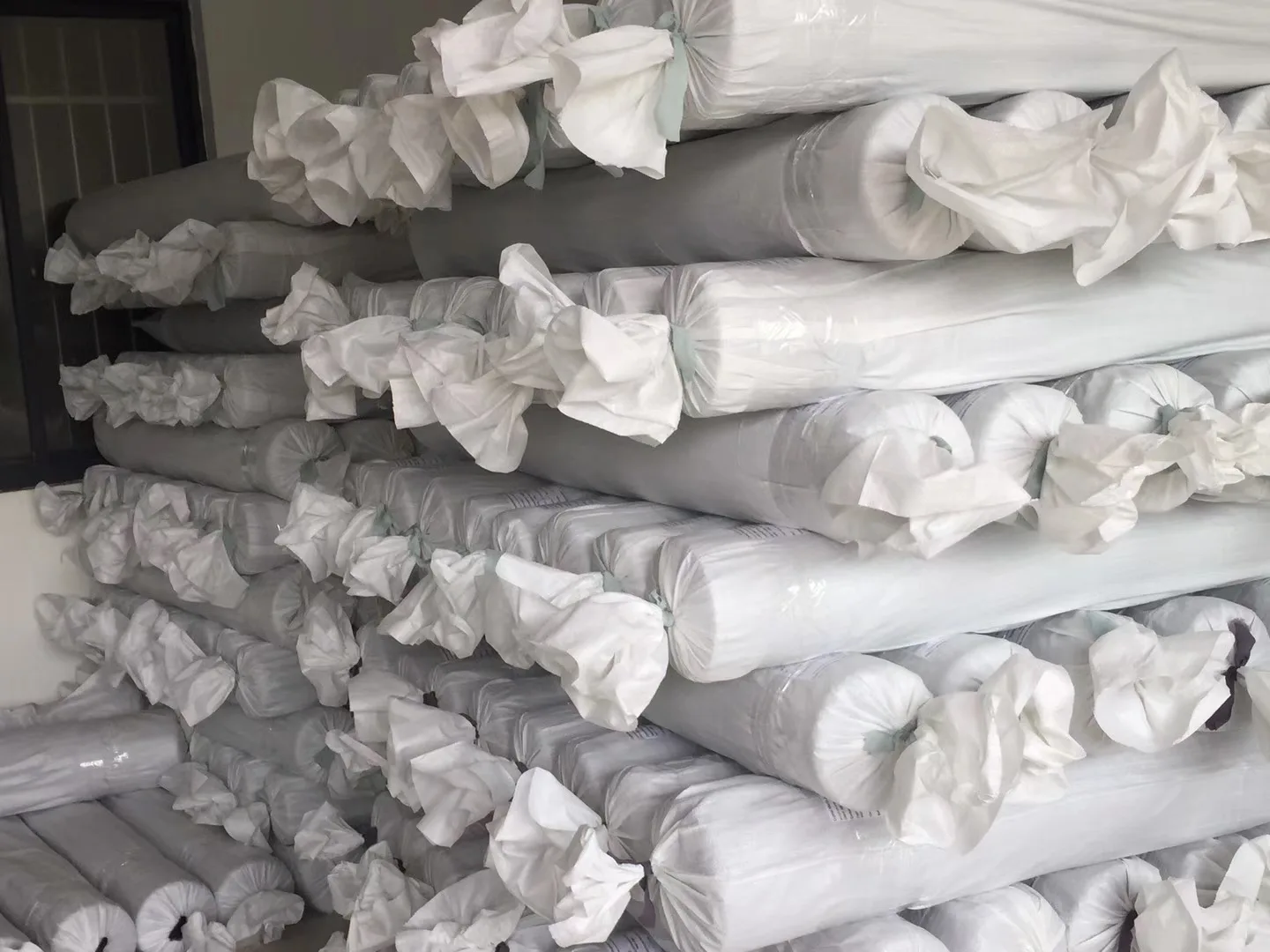 Protected silk fabric rolls prepared for bulk dispatch