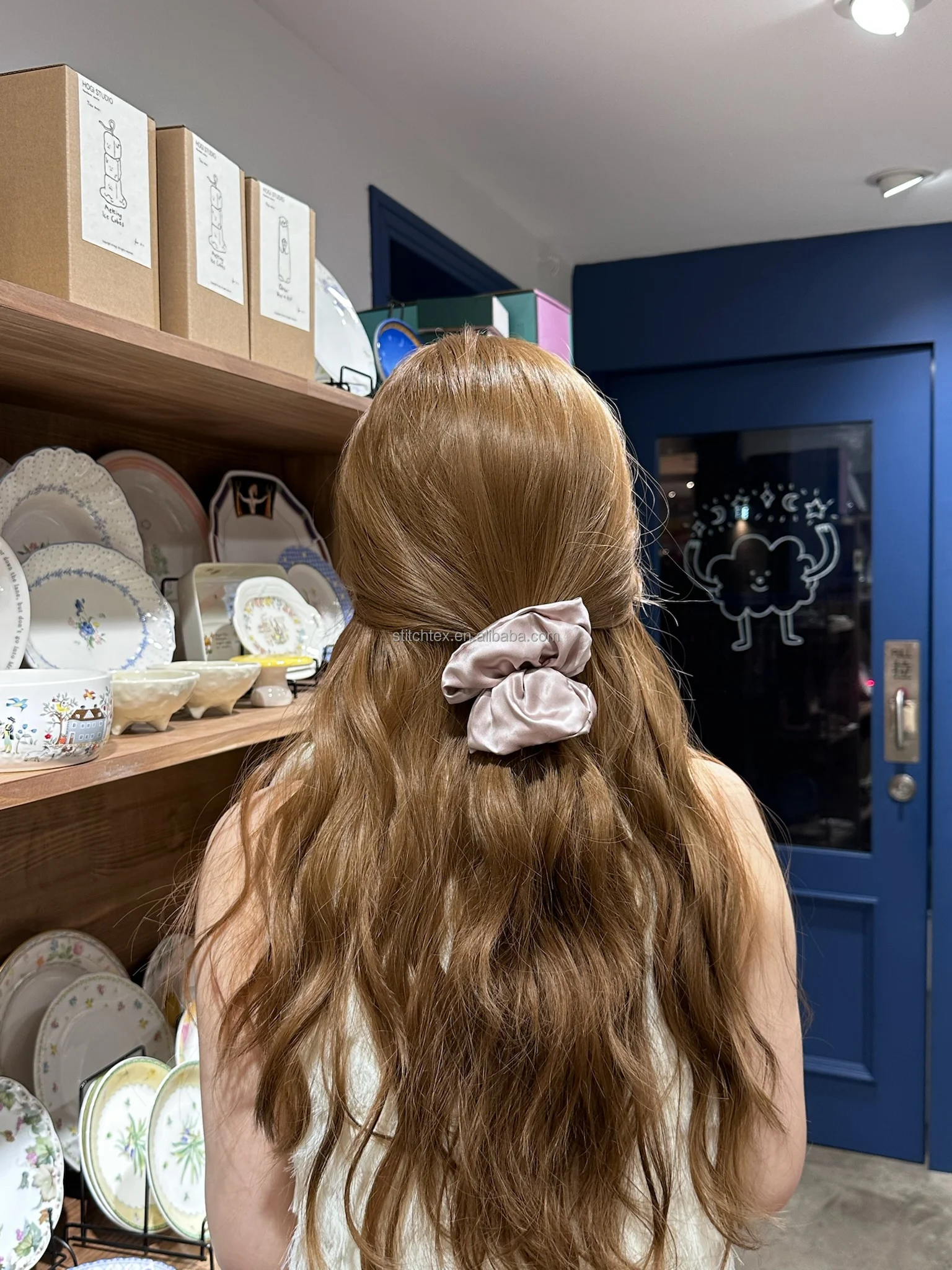 Blush silk scrunchie worn in the hair
