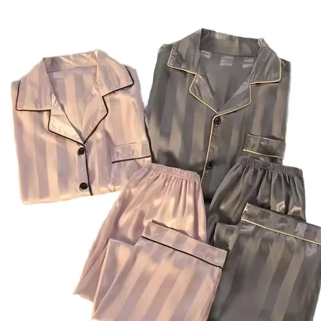 Coordinated blush and charcoal silk pajama sets with contrast piping