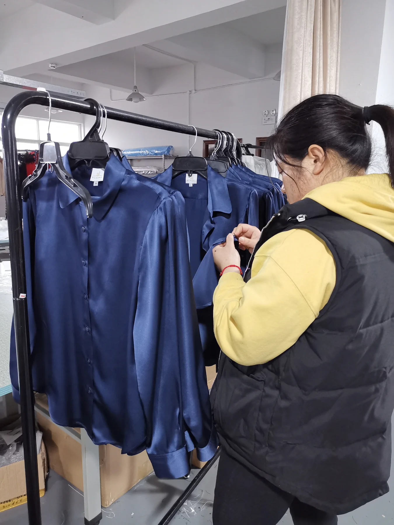 Final workmanship inspection of finished silk sleepwear