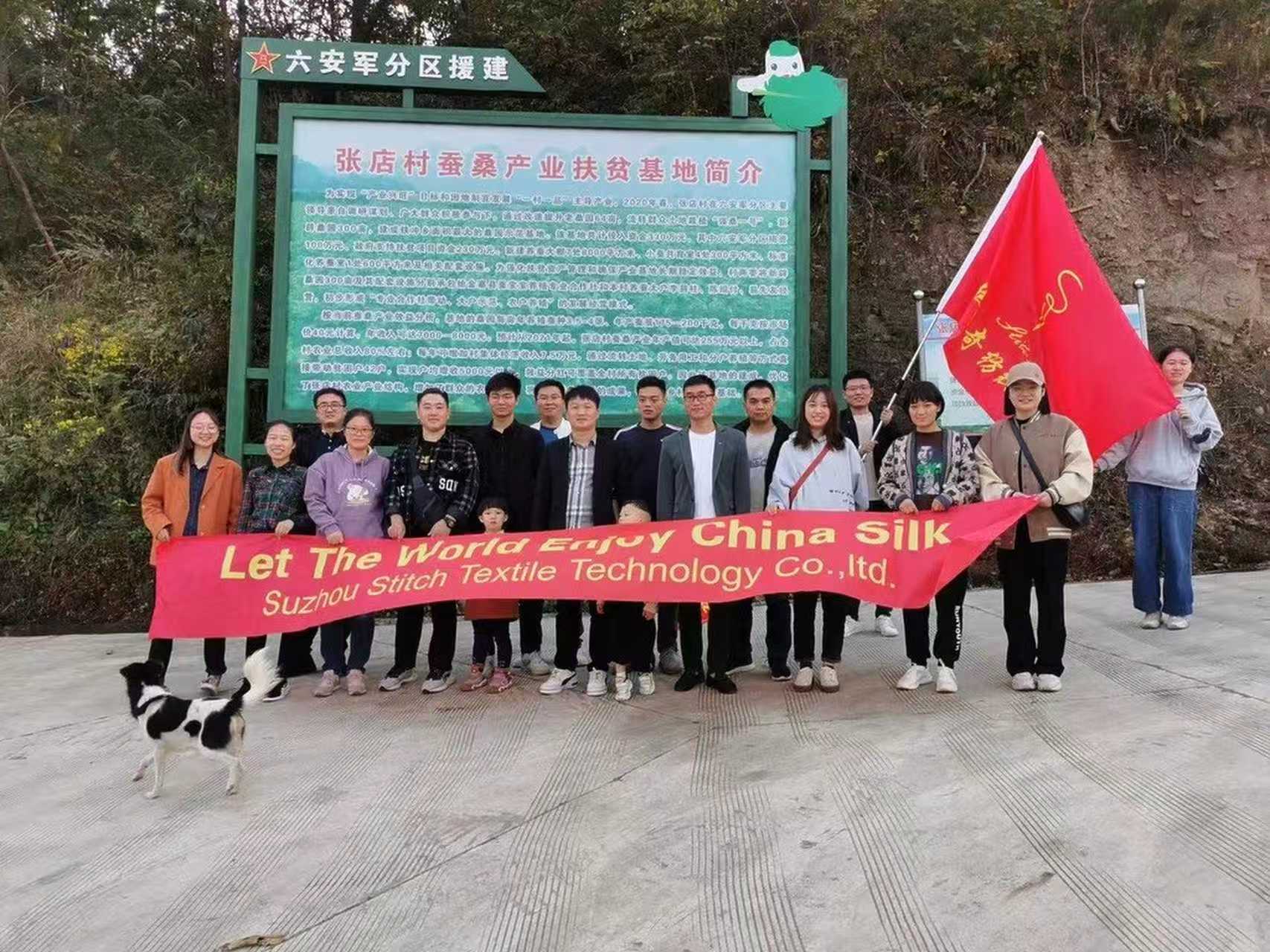 The Stitch Textile team beside the information board at the local sericulture base