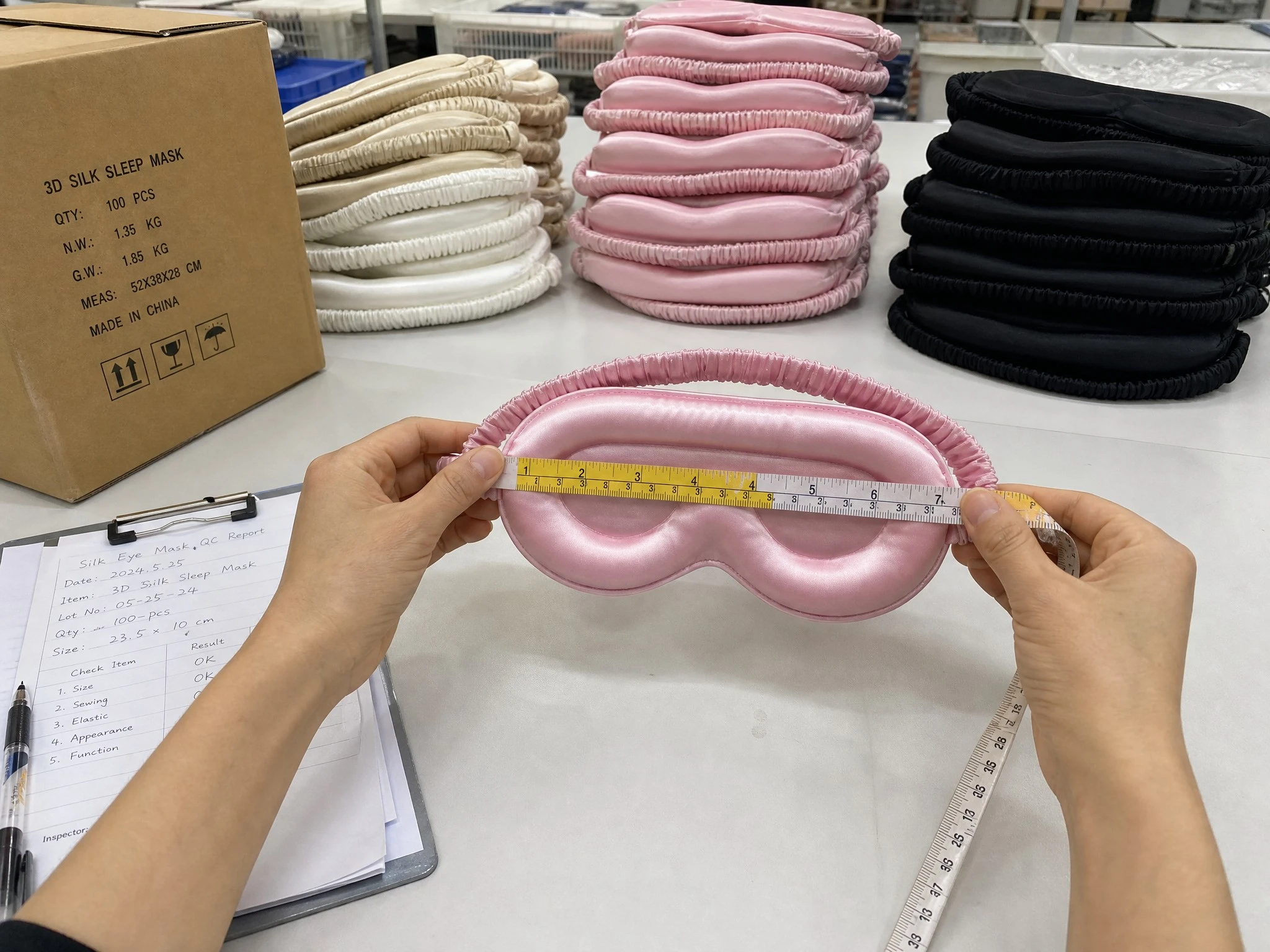 Finished 3D silk eye masks arranged for quality review